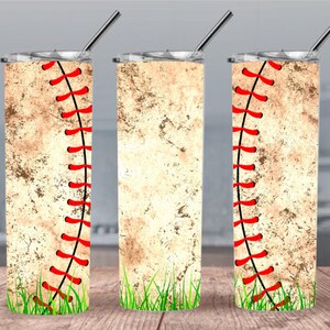 May include: Three stainless steel tumblers with a baseball-themed design. The tumblers feature a distressed, vintage-looking baseball with red stitching and green grass at the bottom.