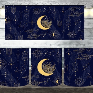May include: White ceramic mug with a celestial design. The navy blue background features gold moons, stars, constellations, and feathers. The design wraps around the mug, with a large crescent moon and floral accents on the front.