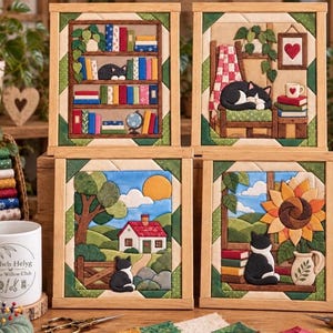 May include: Four square fabric wall art pieces in light wooden frames. Each features a cat-themed scene: a bookshelf with a cat, a cat sleeping in a chair, a cat in a landscape with a house, and a cat sitting by a sunflower and books.