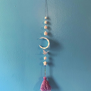 Origami hanging mobile with pink tassel