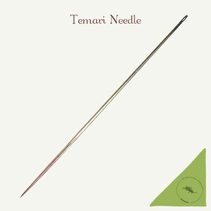 May include: A long, thin, silver-coloured temari needle. The needle is sharp at one end and has a blunt end on the other side.