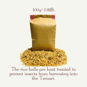 May include: A brown paper bag with a pink tape seal, containing 0.22 pounds of rice hulls. The rice hulls are heat treated to prevent insects from burrowing into the Temari.