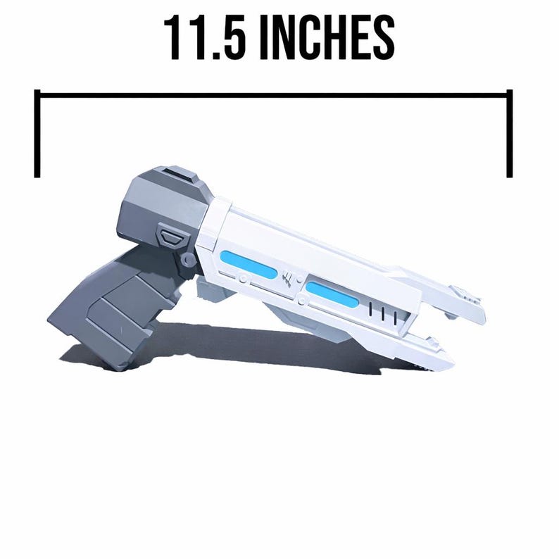 May include: A sci-fi style toy blaster in white and gray with bright blue accents along the barrel. The blaster features a geometric design and measures 11.5 inches in total length as indicated by the measurement graphic above the object.