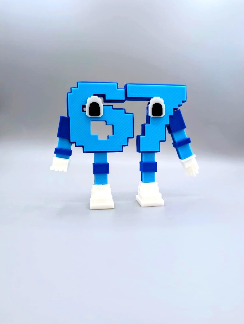 May include: A whimsical, pixelated sculpture of the number 67 in bright blue. The numbers have googly eyes, arms, legs, and white hands and feet, giving them a playful, cartoonish appearance. The design is simple and colorful.