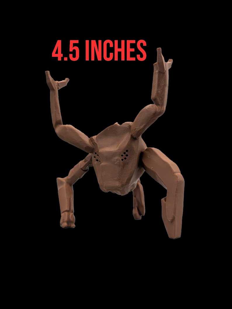 May include: A brown, insect-like sculpture with six articulated limbs and a segmented body. The sculpture is 4.5 inches in height and is set against a black background. The text "4.5 INCHES" is displayed in red above the sculpture.