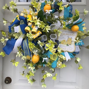 Spring and Summer Lemon-Lemonade front door wreath. Yellow flowers accent the big bright lemons and lemonade sign. Everyday/Country decor