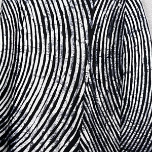 May include: A textile fabric featuring a high-contrast black and white pattern of curved, radiating lines. The design displays a textured, crackled effect within the white stripes, creating a dynamic visual rhythm across the surface of the material.