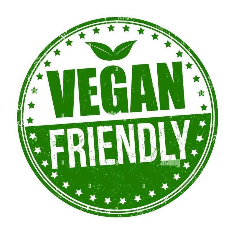 May include: Green round stamp with white text that reads "Vegan Friendly" and a green leaf design.