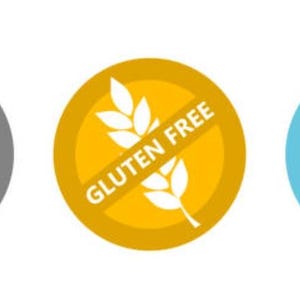 May include: Three round, color-coded icons with a diagonal line through them. The gray icon has a white egg with the text "Egg Free". The yellow icon has a white wheat stalk with the text "Gluten Free". The blue icon has a white milk carton with the text "Dairy Free".