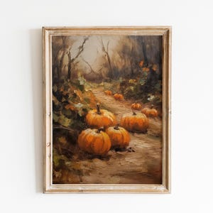 May include: A framed oil painting depicting a path through a forest with pumpkins scattered along the way. The pumpkins are various shades of orange and yellow, and the forest is painted in shades of brown and green.