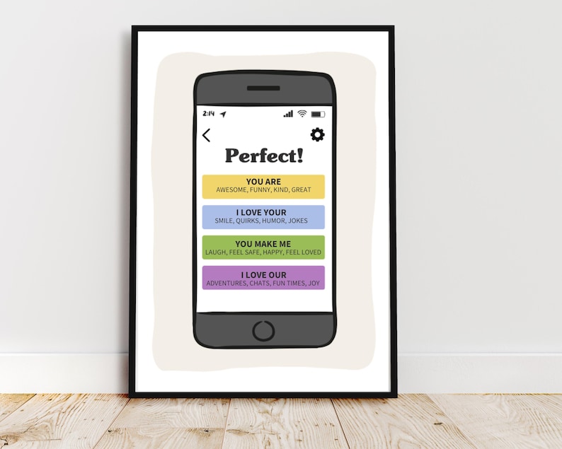 May include: A framed wall art print featuring a dark gray smartphone illustration. The screen displays the text Perfect! followed by four colored rectangular buttons with text: YOU ARE, I LOVE YOUR, YOU MAKE ME, and I LOVE OUR, listing various positive traits.
