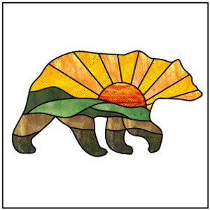 May include: A stained glass silhouette of a bear with a sunset and mountain landscape design. The bear is brown, the sunset is orange and yellow, and the mountains are green.