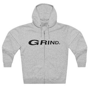 May include: A gray zip-up hoodie with a black "GRIND." logo on the front.