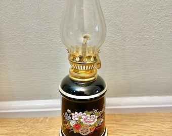 Japanese Black Porcelain Floral Lamp: Decorative Gold Accent