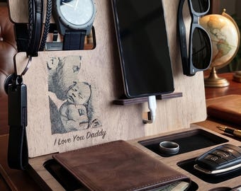 May include: Wooden desk organizer with compartments for a phone, watch, wallet, keys, and sunglasses. Features a photo with the text "I Love You Daddy". Includes a black watch, black sunglasses, and a brown leather wallet.
