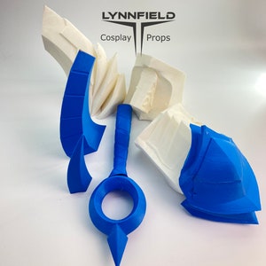 May include: A set of blue plastic molds for making a cosplay prop. The molds are in various shapes, including a ring, a handle, and a curved piece. The molds are on a white surface.