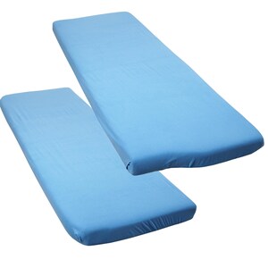May include: Two light blue fitted bed sheets are shown against a white backdrop. The rectangular sheets have rounded corners, suggesting a mattress cover. The fabric appears smooth and wrinkle-free, indicating a high-quality material, suitable for a bed.