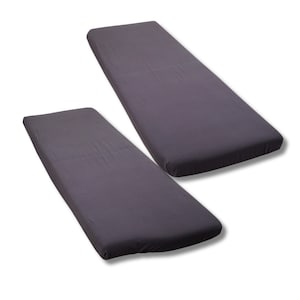 May include: Two dark grey fitted mattress covers. The covers are rectangular with rounded corners and appear to be made of a soft, smooth fabric. The covers are shown on a white background.