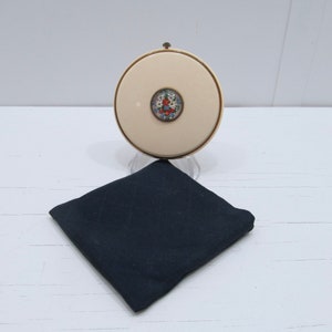 Vintage Mary Dunhill Cream Colored Enamal Compact with Floral Center Design. 1940&#39;s