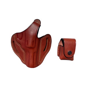 K&ouml;nnte beinhalten: Ein braunes Lederholster mit einem gesteppten Design und einem separaten braunen Ledermagazinbeutel.