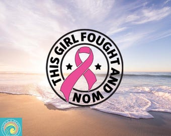 May include: A circular design with the text "THIS GIRL FOUGHT AND WON" in black, surrounding a pink ribbon and two stars. The design is set against a beach scene with a blue sky and ocean.