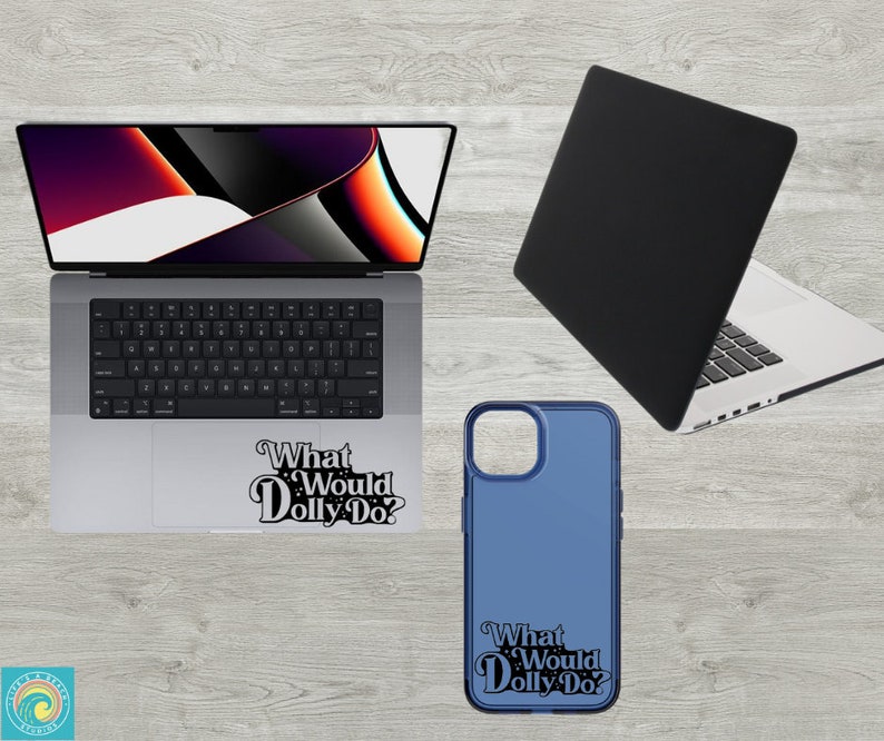 May include: A laptop computer with a black case and a sticker that says "What Would Dolly Do?" on the bottom. A blue phone case with the same sticker is also shown.