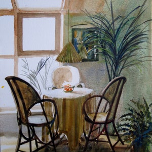 May include: A watercolor painting of a room with two chairs and a table. The table has a brown tablecloth and a bowl of fruit on it. There is a large plant in the corner of the room. The painting is signed and dated "Joan Catterall 21.08.2012".