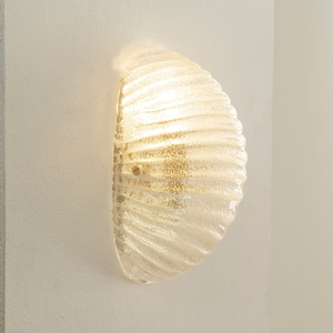 Murano glass shell wall sconce in crystal colour with brass structure, Made in Italy wall lamp