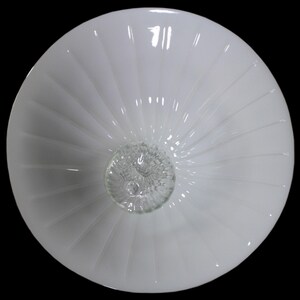 A white, round bowl with a spiral pattern on its surface.