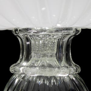 A close-up view of a clear glass lampshade, showcasing its intricate design and texture.