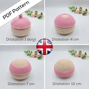 May include: A crochet PDF pattern featuring four spherical models in beige and pink, labeled with text including Dilatation 1 doigt, 4 cm, 7 cm, and 10 cm. The items demonstrate progressive stages of dilation with varying pink and beige color patterns.