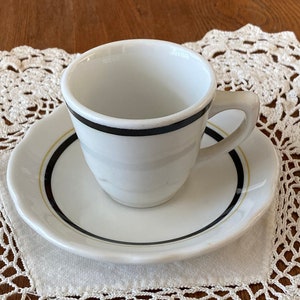 Vintage Demitasse Jackson China Cup and Saucer with Black Trim on Cup and Black Trim and Gold Strip on Saucer.