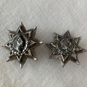 Vintage Monet Roman Caesar Silver Tone Clip On Earrings.