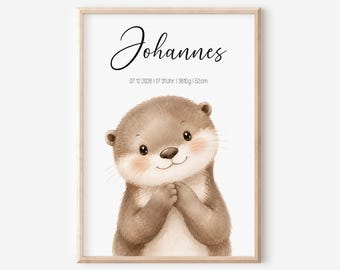 May include: A framed wall print featuring a watercolor illustration of a brown otter with rosy cheeks. The text reads Johannes, 07.12.2026, 17:31Uhr, 3610g, 52cm. The print is enclosed in a light-colored wooden frame against a plain white background.