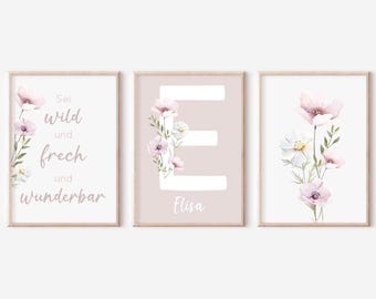 May include: Three pink and white floral prints with a pink background. The first print has the text "Sei wild und frech und wunderbar". The second print has the letter "E" and the name "Elisa" below it. The third print has a bouquet of pink and white flowers.