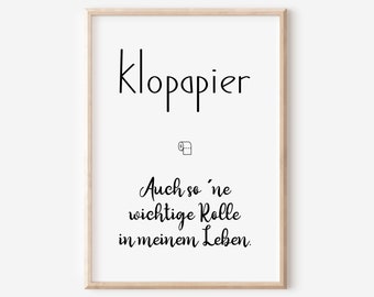 May include: A framed print with the word "klopapier" at the top, followed by a small toilet paper roll icon. Below, the text reads "Auch so 'ne wichtige Rolle in meinem Leben." The print is in black and white.