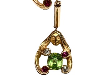 14k Peridot, sculpted face earrings