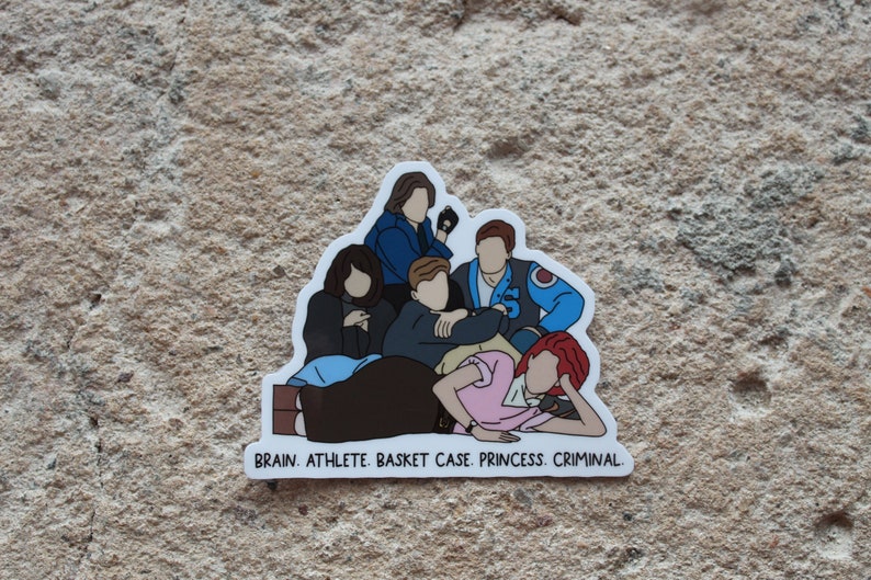 May include: A sticker featuring a group of five cartoon figures, with the text "BRAIN. ATHLETE. BASKET CASE. PRINCESS. CRIMINAL." at the bottom.