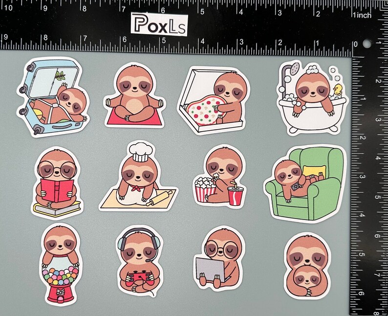 May include: A set of ten sloth stickers featuring different activities, including eating pizza, taking a bath, reading a book, baking, watching a movie, sleeping in a chair, playing video games, eating candy, wearing glasses and hugging. The stickers are printed on white paper with a glossy finish.