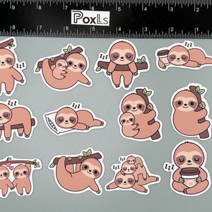 May include: A set of ten sloth stickers featuring various poses, including sleeping, holding a cup of coffee, and cuddling. The stickers are printed on white paper with a glossy finish.