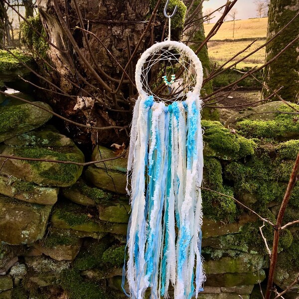 Small dreamcatcher style wall hanging, a tumbling cascade of upcycled fabric ribbons in aqua, pale blue, white and twinkling silver, 5* gift