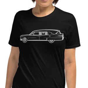 May include: A black t-shirt with a white outline of a vintage hearse.