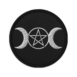 May include: A black embroidered patch featuring a silver triple moon and pentagram symbol.