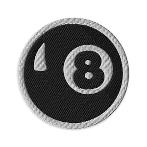May include: Embroidered patch with a black 8-ball design. The number 8 is white, with a white outline. The patch has a black background and a grey border. Suitable for jackets, bags, or other fabric items.