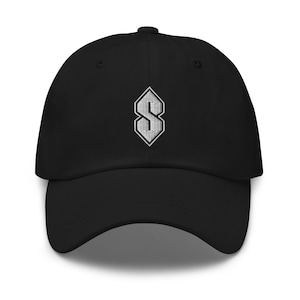 May include: Black baseball cap with a white embroidered "S" logo on the front. The cap has a curved brim and a fabric strap closure on the back. The hat is made of a soft, durable material.