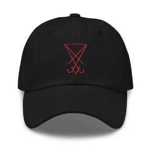 May include: Black baseball cap with a red embroidered symbol of a pentagram with a cross inside.