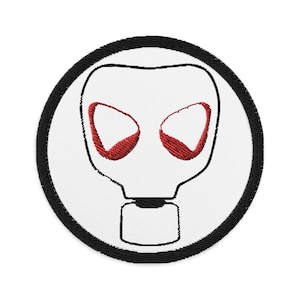 May include: A white embroidered patch with a black outline of a gas mask with red eyes. The patch is circular and has a black border.
