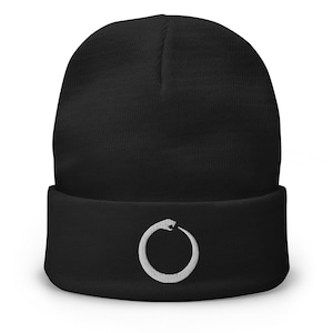May include: Black beanie with a white embroidered circle containing a snake design.