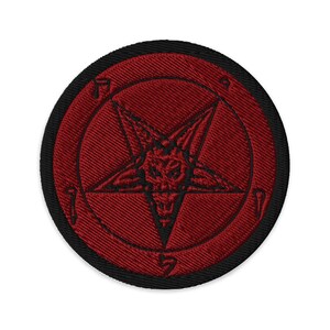 May include: Embroidered patch featuring a red pentagram with a demonic face in the center, set against a red background. The patch has a black border. The design is a symbol often associated with occult or alternative subcultures.