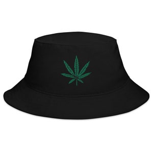 May include: Black bucket hat with a green marijuana leaf embroidered on the front.